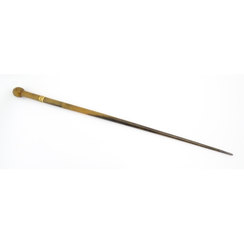 1273 - A late 19thC rhino horn walking stick / cane with yellow metal collar and mount to top. Approx. 35