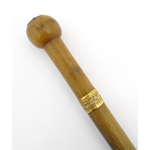 1273 - A late 19thC rhino horn walking stick / cane with yellow metal collar and mount to top. Approx. 35