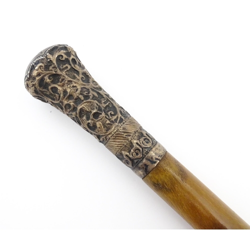 1274 - A late 19thC rhino horn walking stick / cane with embossed white metal top with acanthus scroll and ... 