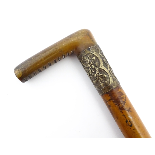 1275 - A Victorian antler handled walking stick / cane with an embossed silver plate collar. Approx. 32 1/2... 