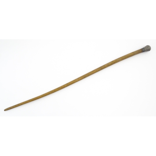 1279 - An early 20thC bull pizzle walking stick / cane with white metal pommel, possibly Indian. Approx. 34... 