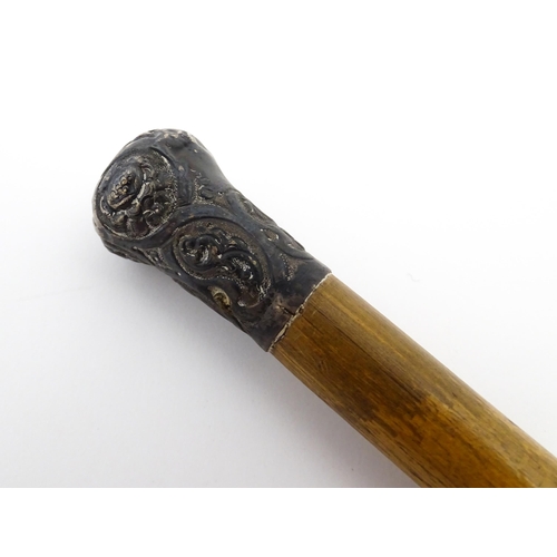 1282 - An early 20thC Sunday stick formed as a stylised golf club. Together with a swagger stick with white... 