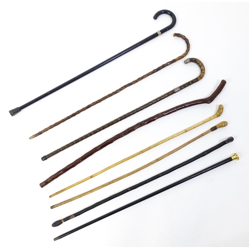 1285 - A 20thC quantity of walking sticks / cane, to include various examples, some with silver mounts. Lar... 