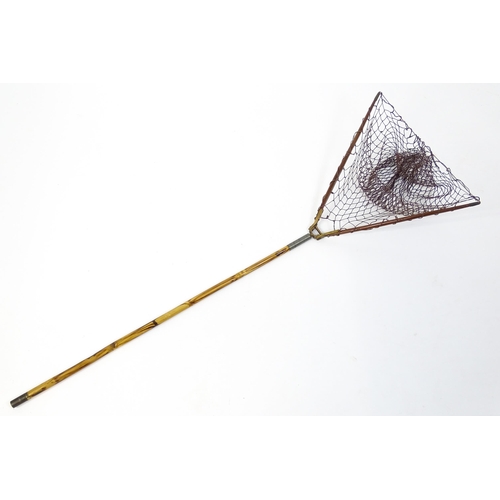 1286 - An early 20thC folding fishing / angling landing net, the bamboo shaft supporting a mahogany frame w... 