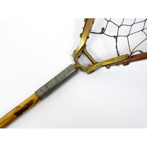 1286 - An early 20thC folding fishing / angling landing net, the bamboo shaft supporting a mahogany frame w... 