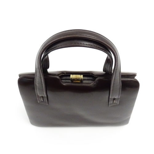 1328 - Vintage fashion / clothing: Six brown leather handbags. Together with a brown leather wallet. The la... 