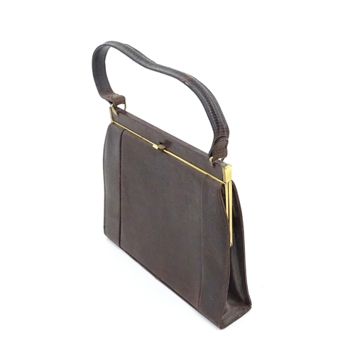 1328 - Vintage fashion / clothing: Six brown leather handbags. Together with a brown leather wallet. The la... 