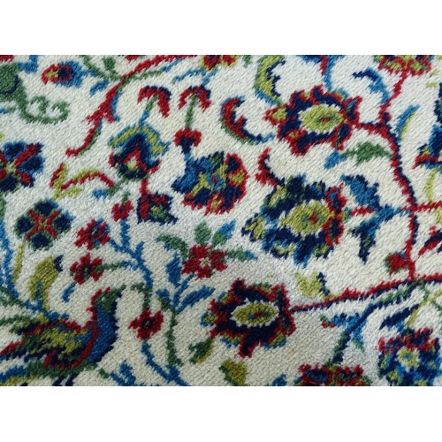 1388 - Carpet / Rug : A Grosvenor Wilton carpet with cream ground rug with central vignette with scrolling ... 