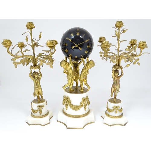 1396 - A late 19thC French white marble ormolu clock garniture, the clock formed as three ormolu putti hold... 