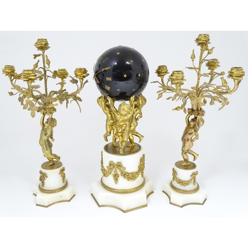 1396 - A late 19thC French white marble ormolu clock garniture, the clock formed as three ormolu putti hold... 