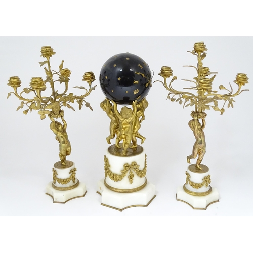 1396 - A late 19thC French white marble ormolu clock garniture, the clock formed as three ormolu putti hold... 