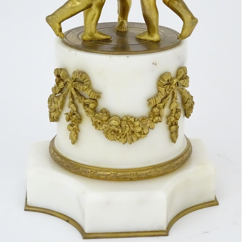 1396 - A late 19thC French white marble ormolu clock garniture, the clock formed as three ormolu putti hold... 