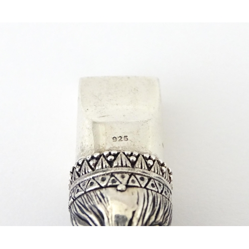 411 - A novelty white metal whistle with fox head decoration. Approx. 1 1/2