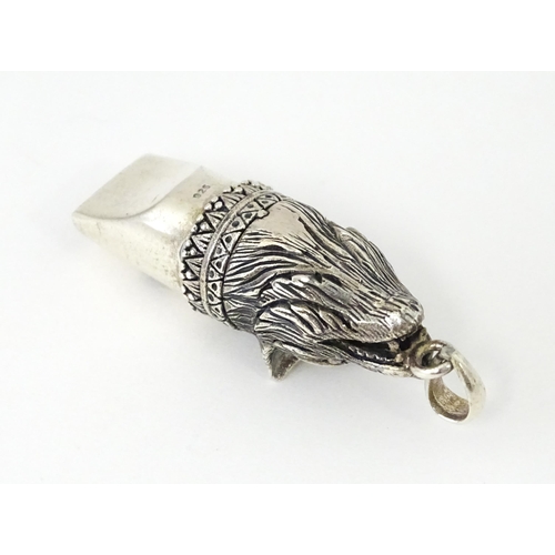 411 - A novelty white metal whistle with fox head decoration. Approx. 1 1/2