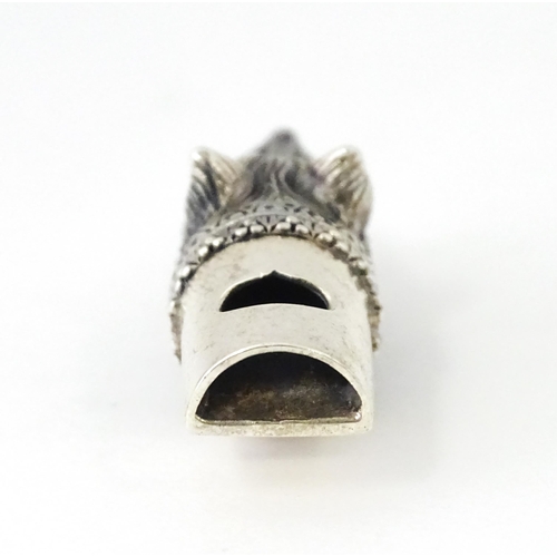 411 - A novelty white metal whistle with fox head decoration. Approx. 1 1/2