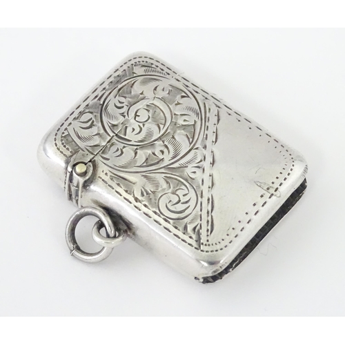 420 - A silver vesta case with engraved acanthus scroll decoration, hallmarked Birmingham 1908, maker Samu... 