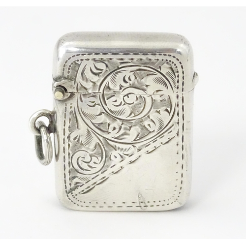 420 - A silver vesta case with engraved acanthus scroll decoration, hallmarked Birmingham 1908, maker Samu... 