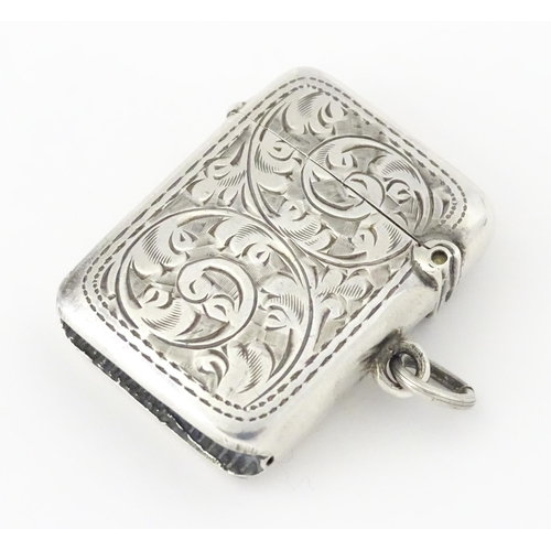 420 - A silver vesta case with engraved acanthus scroll decoration, hallmarked Birmingham 1908, maker Samu... 