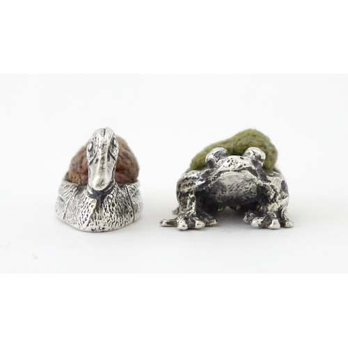 424 - Four white metal novelty pin cushions comprising frog, duck and two teddy bears. Duck approx. 1 1/4