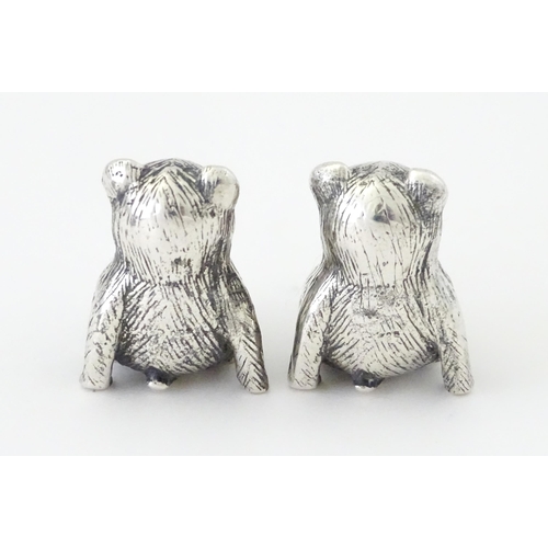 424 - Four white metal novelty pin cushions comprising frog, duck and two teddy bears. Duck approx. 1 1/4