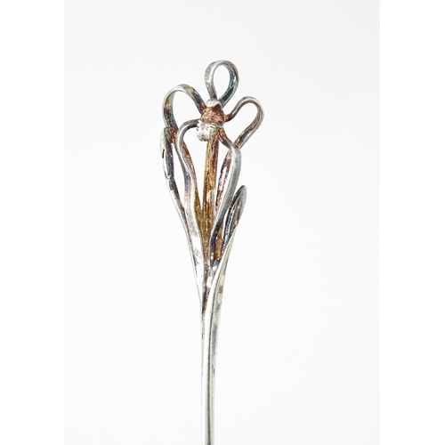 428 - An Australian .925 silver teaspoon the handle surmounted by a spider orchid, maker Harris & Sons of ... 