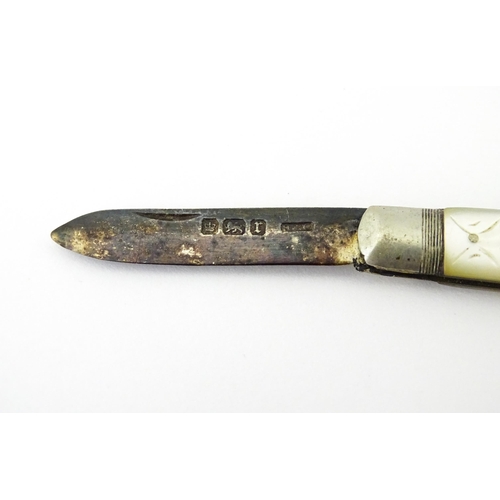 436 - A silver folding fruit knife with mother of pearl handle hallmarked Sheffield 1909, maker Henry Will... 