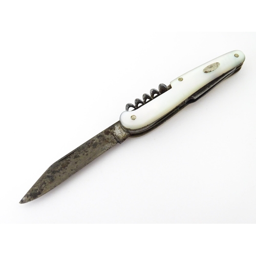 436 - A silver folding fruit knife with mother of pearl handle hallmarked Sheffield 1909, maker Henry Will... 