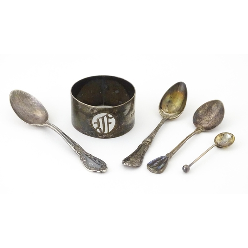 438 - Four assorted silver spoons. 

A silver napkin ring hallmarked Birmingham 1923, maker S. Blanckensee... 