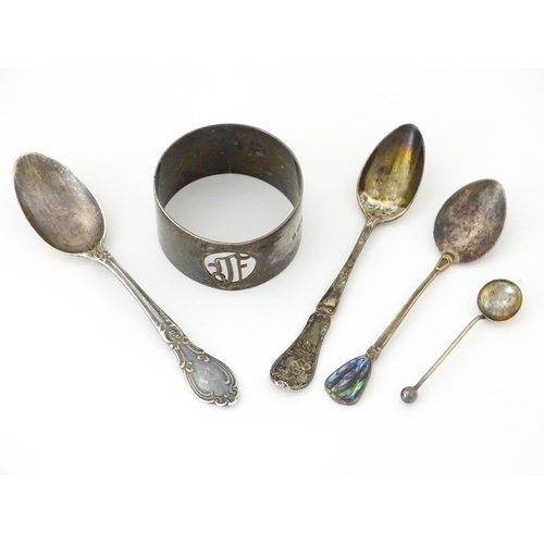 438 - Four assorted silver spoons. 

A silver napkin ring hallmarked Birmingham 1923, maker S. Blanckensee... 