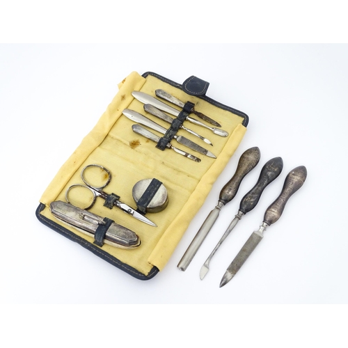 440 - A quantity of silver manicure tools etc within a leather case having engine turned decoration and ha... 