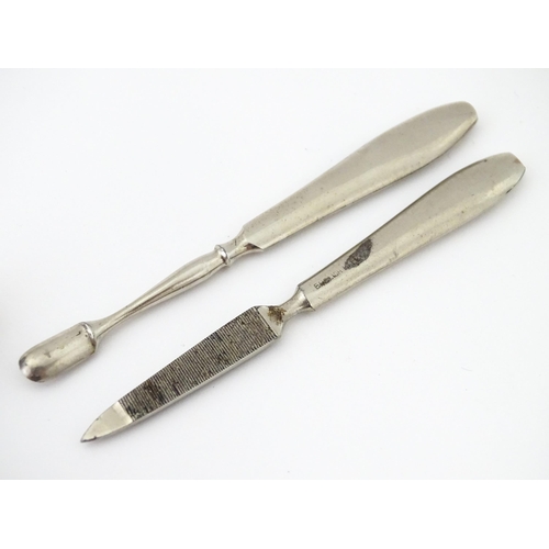 440 - A quantity of silver manicure tools etc within a leather case having engine turned decoration and ha... 