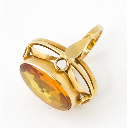 618 - A yellow metal cocktail ring set with central orange citrine. Ring size approx. N 1/2