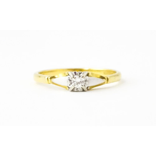 628 - An 18ct gold ring set with central diamond solitaire. Ring size approx. T 1/2