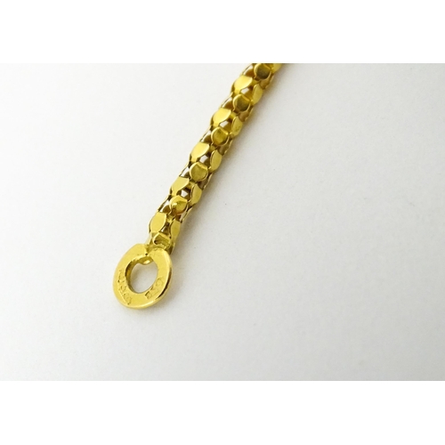 638 - An 18ct gold, 14ct gold and yellow metal necklace. Approx. 18