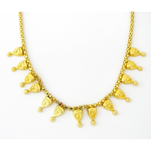 638 - An 18ct gold, 14ct gold and yellow metal necklace. Approx. 18