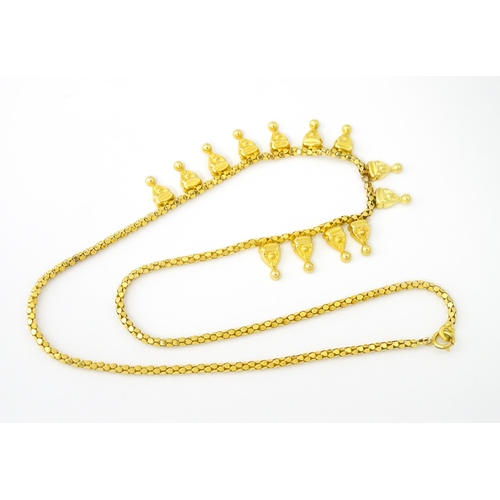 638 - An 18ct gold, 14ct gold and yellow metal necklace. Approx. 18