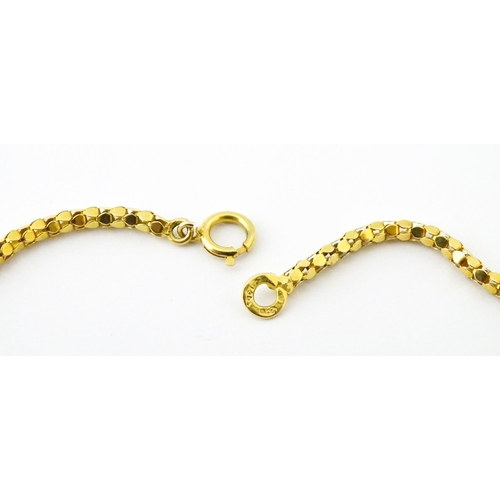 638 - An 18ct gold, 14ct gold and yellow metal necklace. Approx. 18