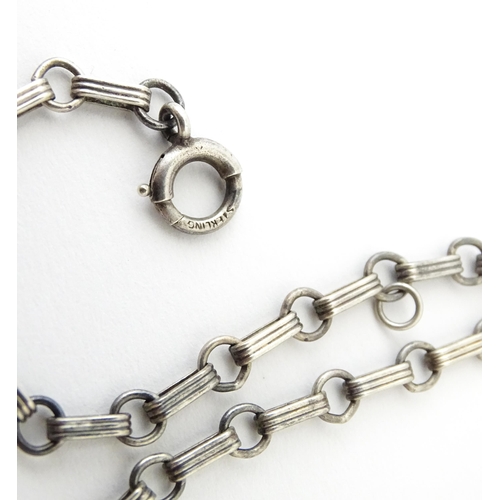 641 - A silver chain bracelet with padlock formed clasp having guilloche enamel and floral detail. Approx.... 