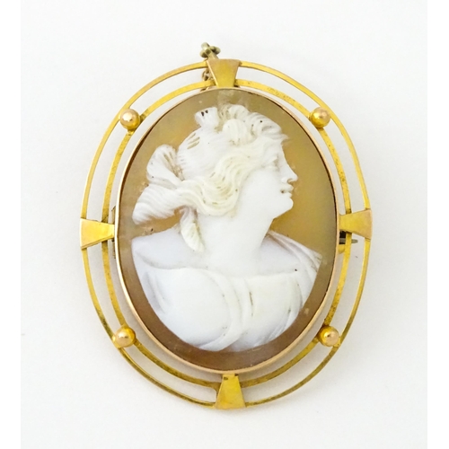 647 - A shell carved cameo within a 9ct gold brooch mount. Approx. 1 1/2