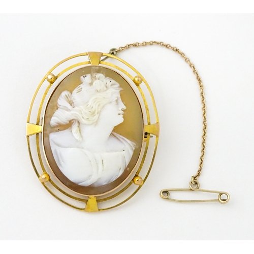 647 - A shell carved cameo within a 9ct gold brooch mount. Approx. 1 1/2