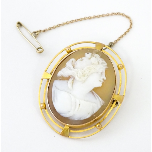 647 - A shell carved cameo within a 9ct gold brooch mount. Approx. 1 1/2