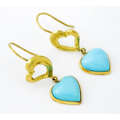 648 - A pair of 18ct gold drop earrings with heart detail, and set with turquoise coloured cabochon of hea... 