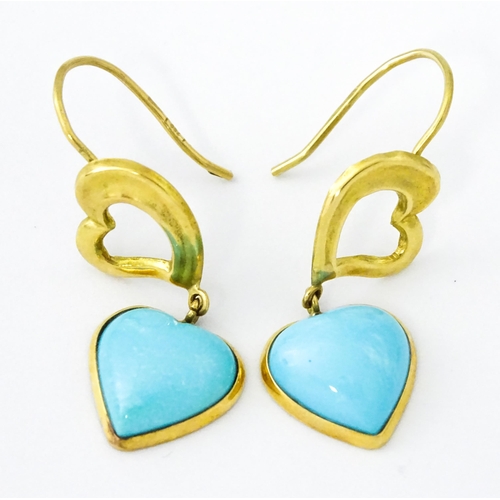 648 - A pair of 18ct gold drop earrings with heart detail, and set with turquoise coloured cabochon of hea... 