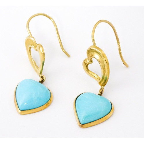 648 - A pair of 18ct gold drop earrings with heart detail, and set with turquoise coloured cabochon of hea... 