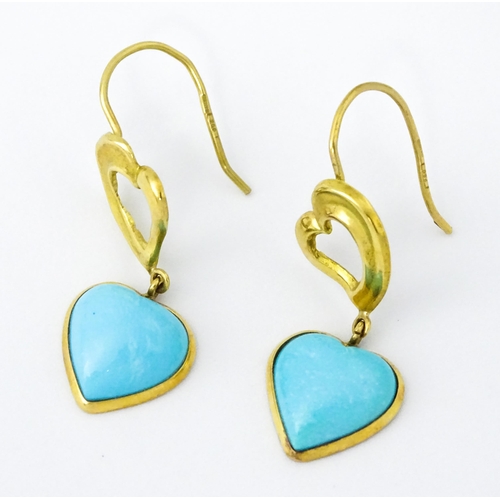 648 - A pair of 18ct gold drop earrings with heart detail, and set with turquoise coloured cabochon of hea... 