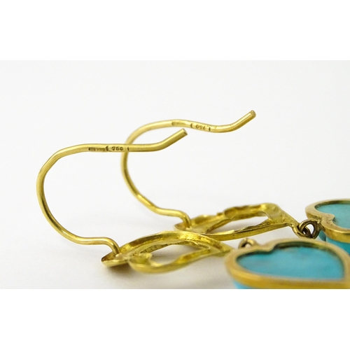 648 - A pair of 18ct gold drop earrings with heart detail, and set with turquoise coloured cabochon of hea... 