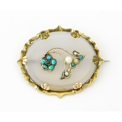 649 - A late 19th / early 20thC brooch set with central chalcedony panel with turquoise and seed pearl det... 