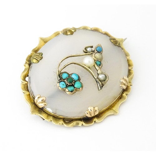 649 - A late 19th / early 20thC brooch set with central chalcedony panel with turquoise and seed pearl det... 