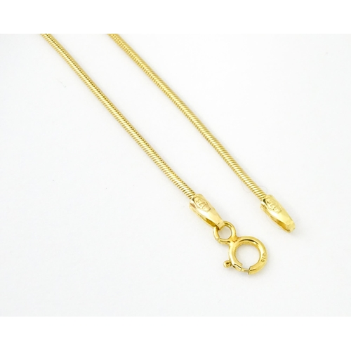 653 - A 9ct gold pendant on chain, the Modernist pendant set with pink stone, by Carrick Jewellery Ltd. Pe... 