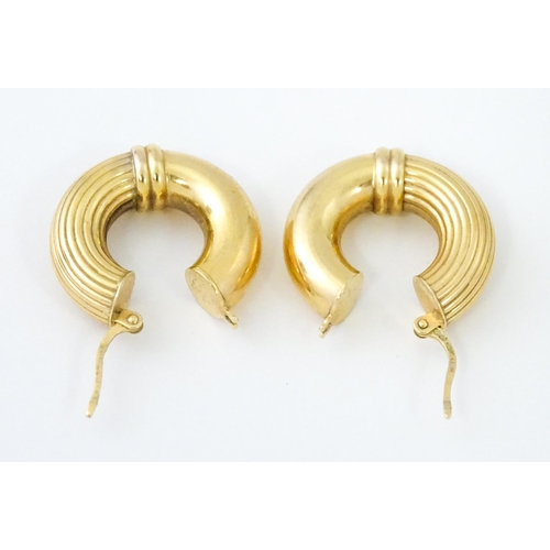 654 - A pair of 9ct gold hoop earrings. Approx. 3/4